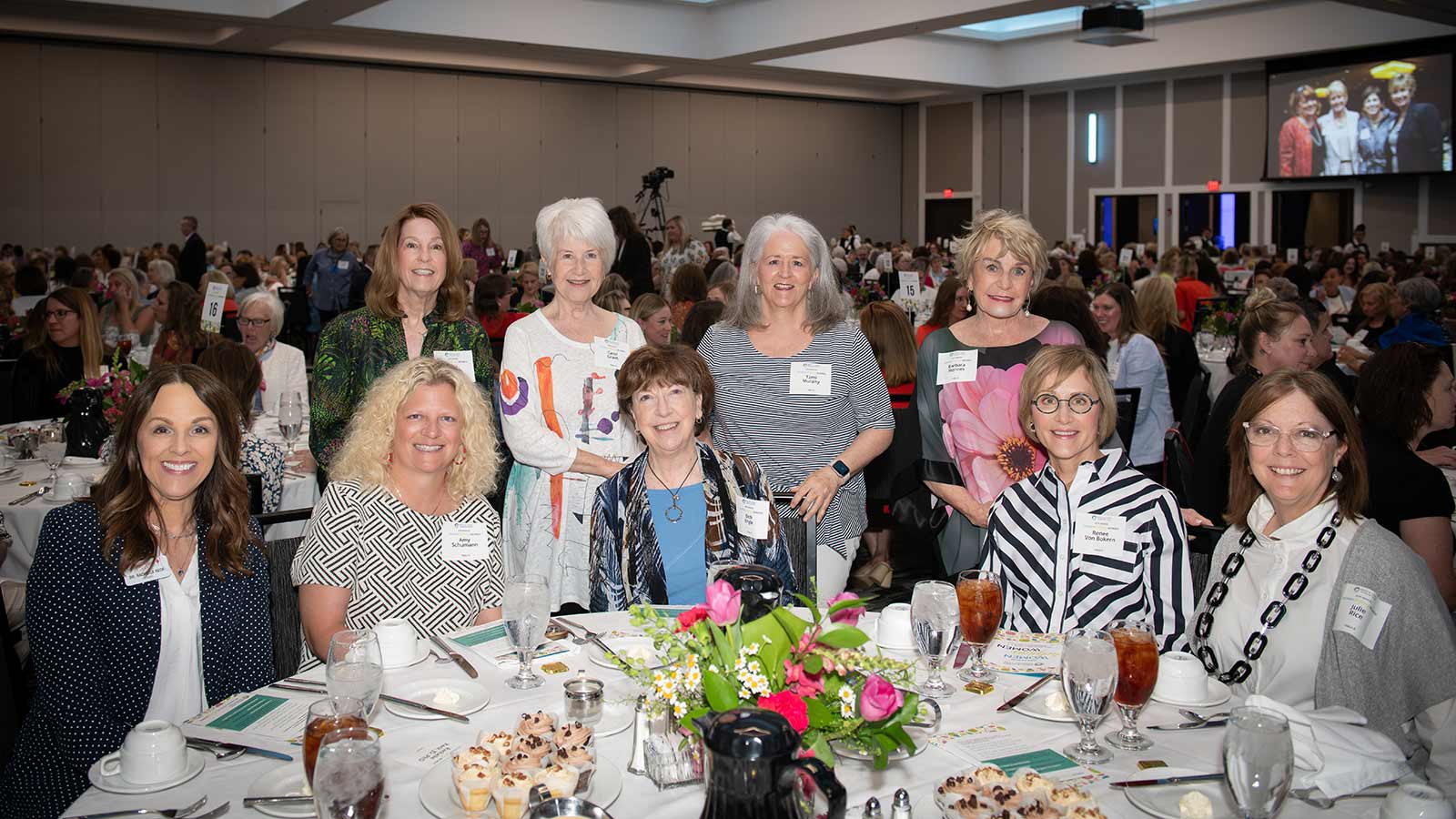 Nine women together at their table at Mind & Spirit Counseling Center's 2024 Women Helping Women luncheon