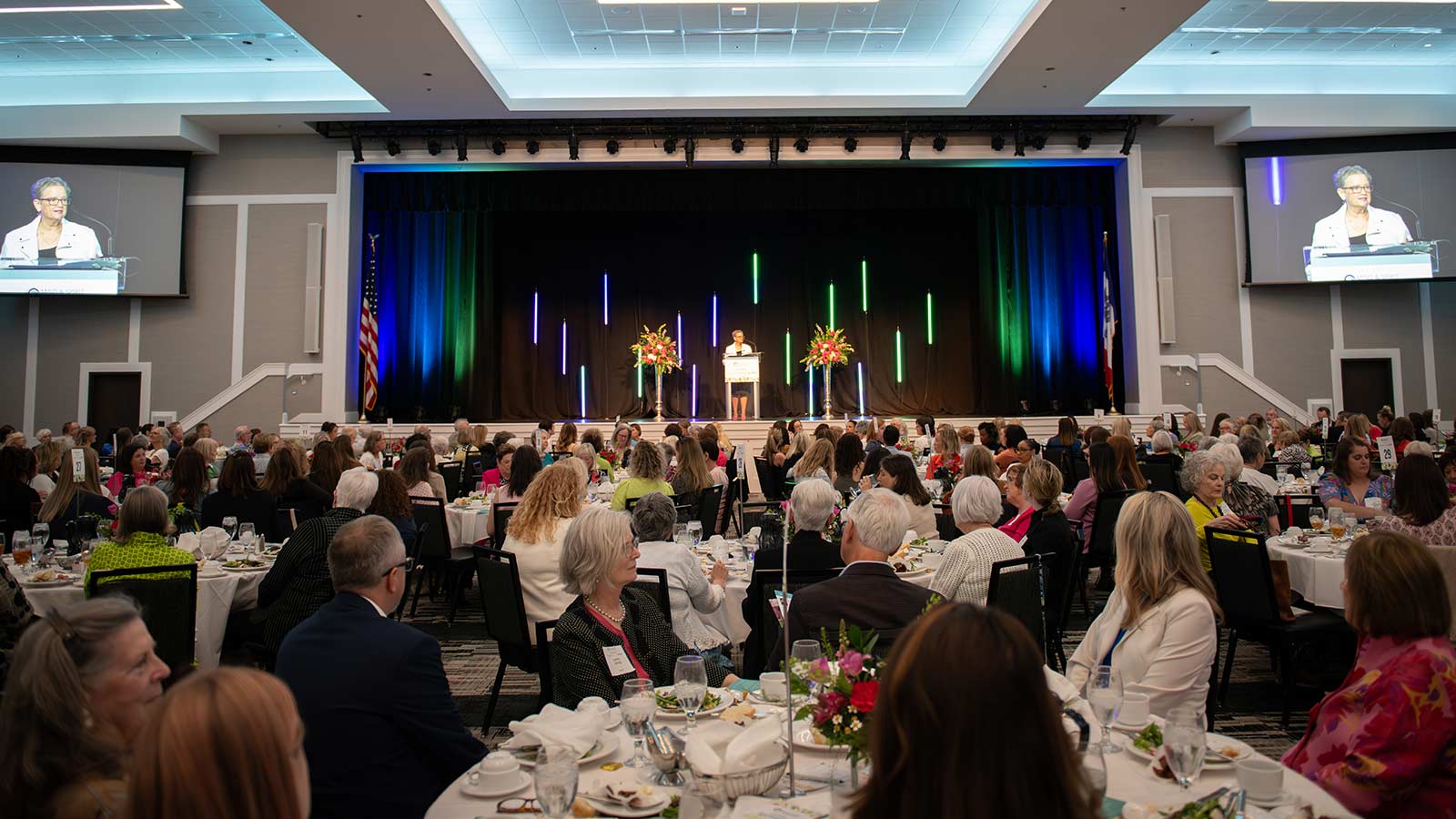 Speaker Teri Hughes-Paulline speaks to a large crowd at Mind & Spirit Counseling Center's 2024 Women Helping Women luncheon